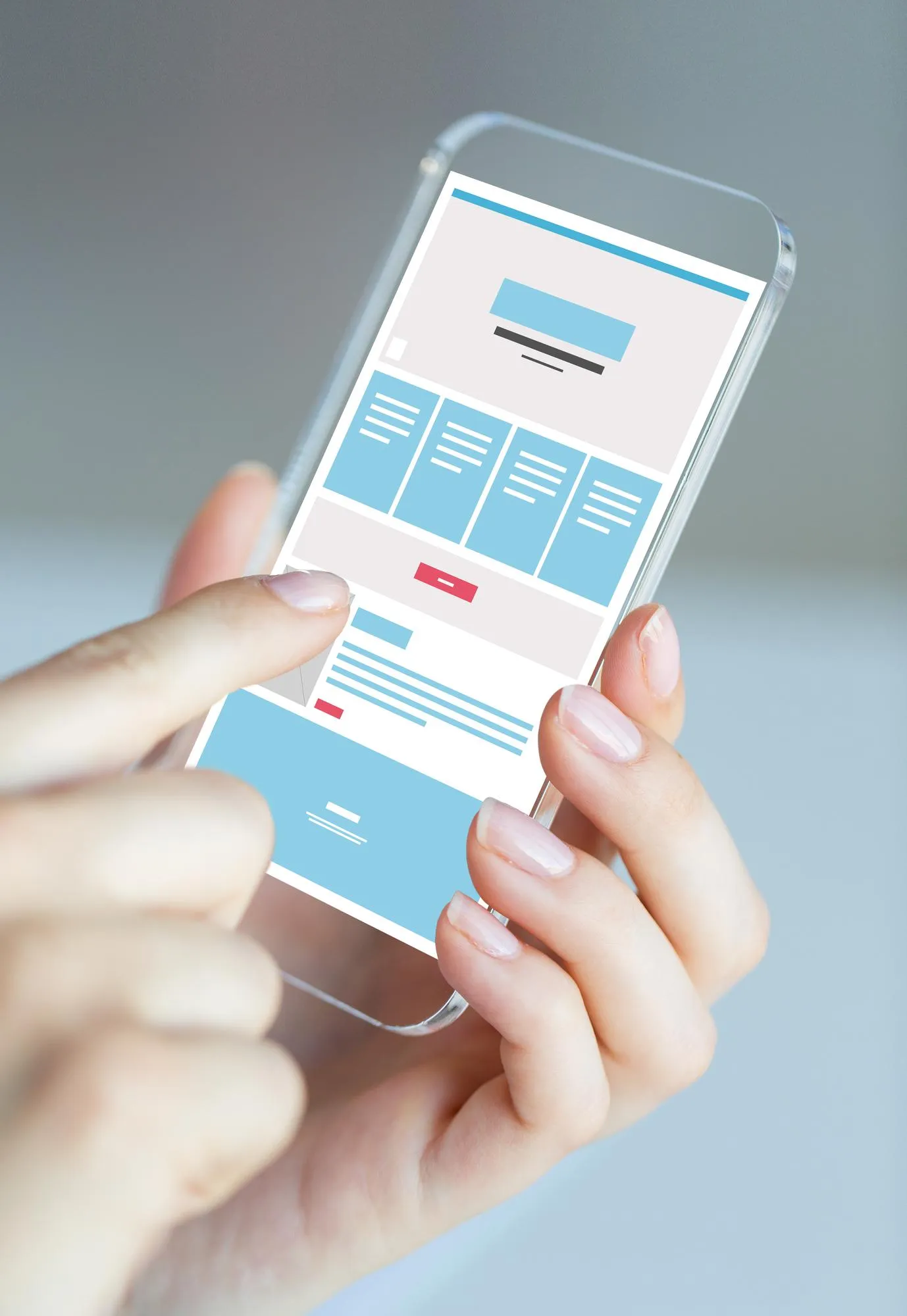 Hand holding a smartphone showing a website wireframe