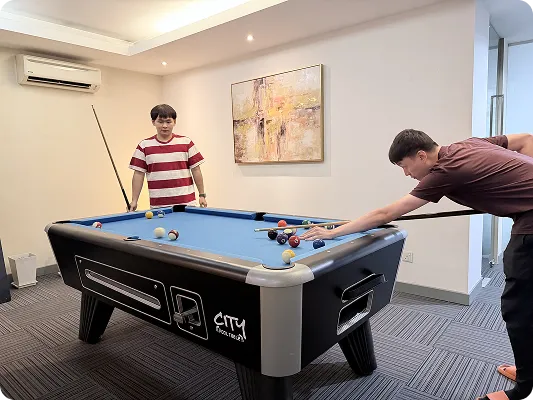 O2O Digital staff playing pool in the office games room
