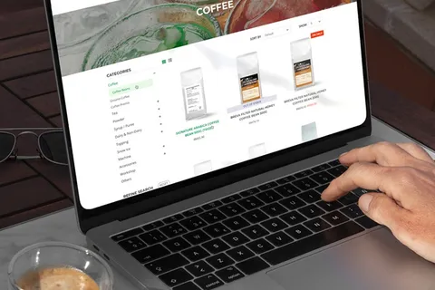 Laptop showing a coffee brand online store product catalogue