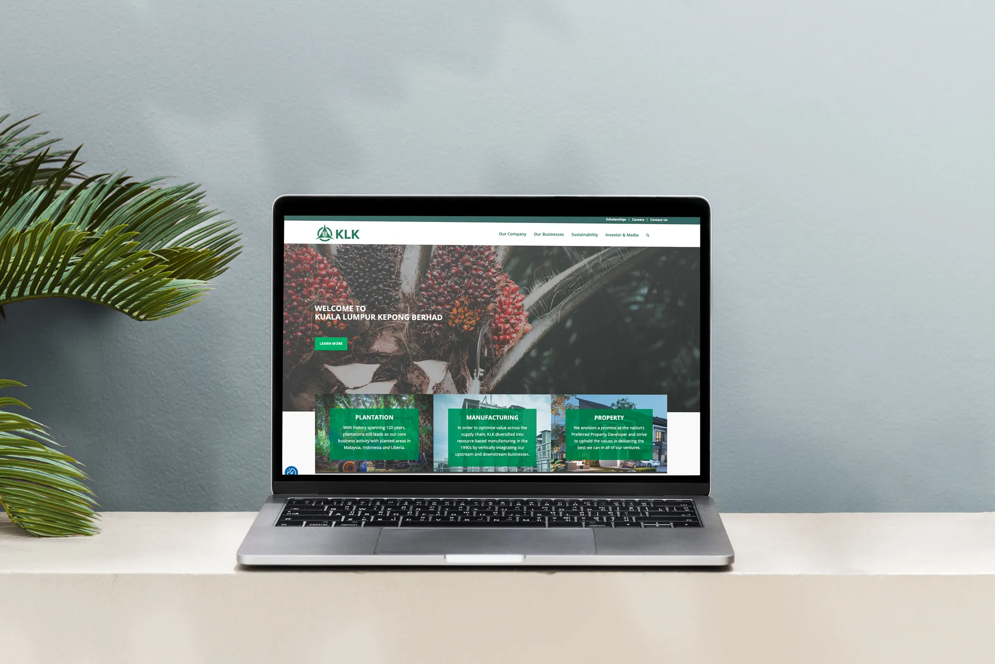 KLK corporate website on a laptop, designed by O2O Digital