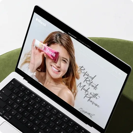 Mandi brand website homepage on a laptop
